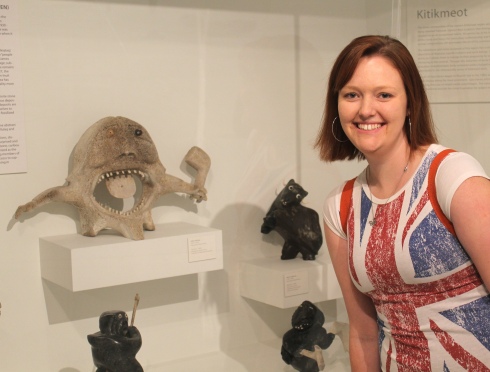 A museum studies student visits MIA and stands next to her favourite sculpture.